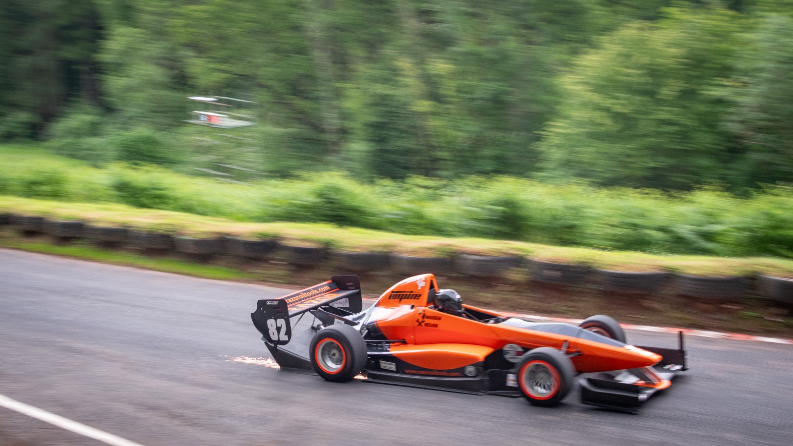 Orange Empire racing car at speed