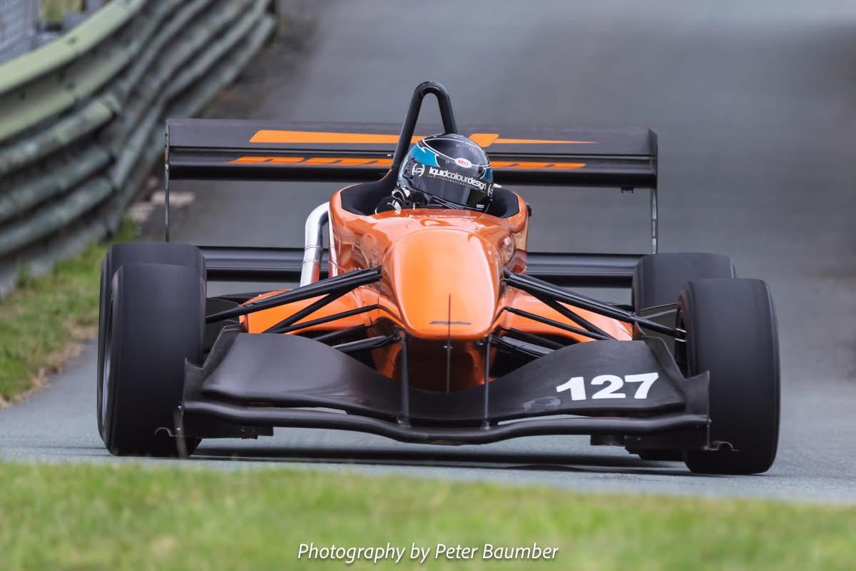 William Loughridge competing in his orange Empire Wraith
